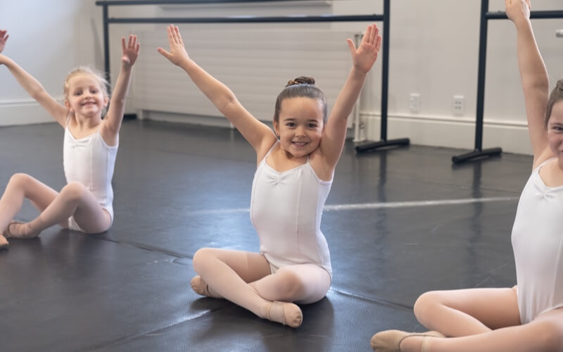 Smiling young ballet student in class